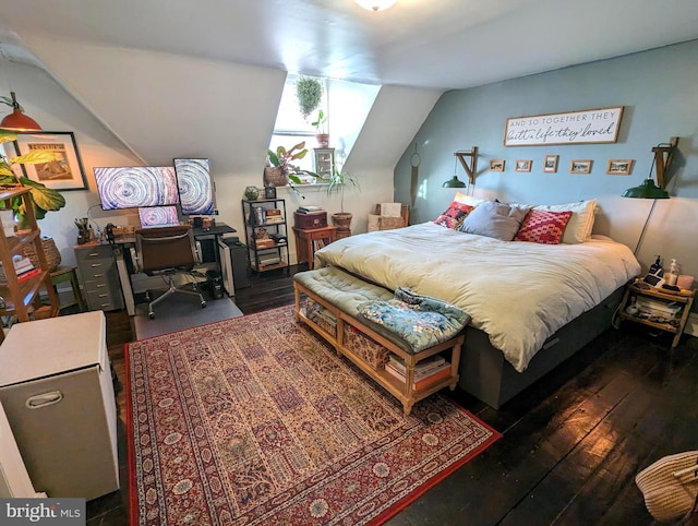 bedroom with dark wood-type flooring and vaulted ceiling