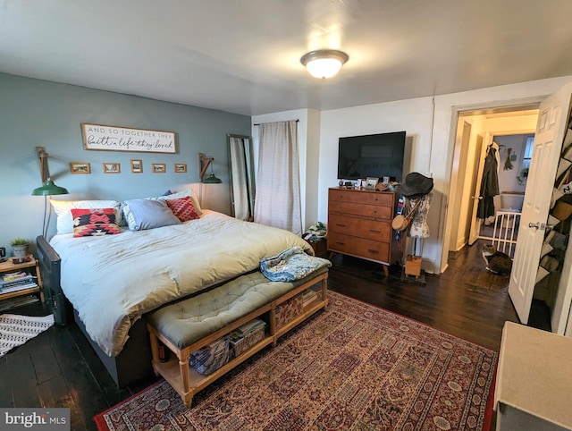 bedroom featuring dark wood-type flooring