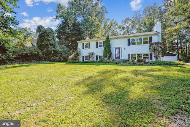 bi-level home with a front yard