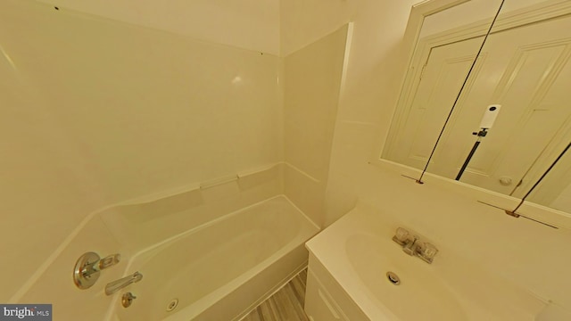 bathroom with shower / bathing tub combination and vanity