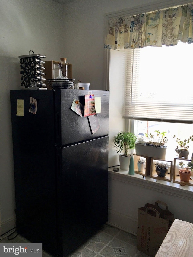 kitchen with black fridge