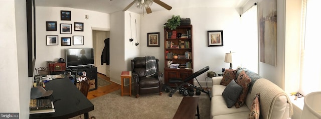 interior space with ceiling fan