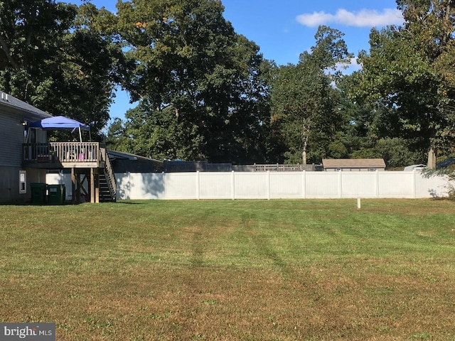 view of yard with a wooden deck