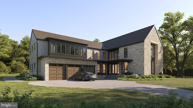 view of front of home featuring a front yard and a garage