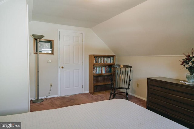 bedroom featuring carpet floors and lofted ceiling