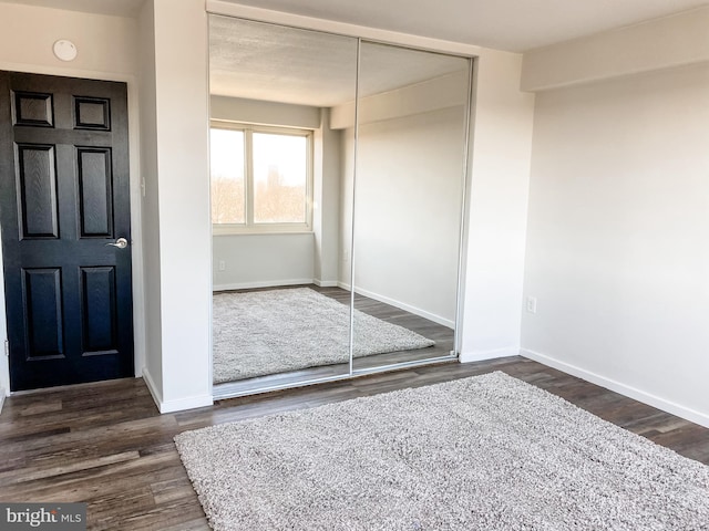 entrance foyer featuring dark hardwood / wood-style floors