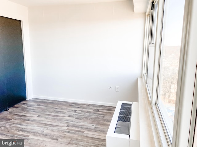 spare room with light hardwood / wood-style floors