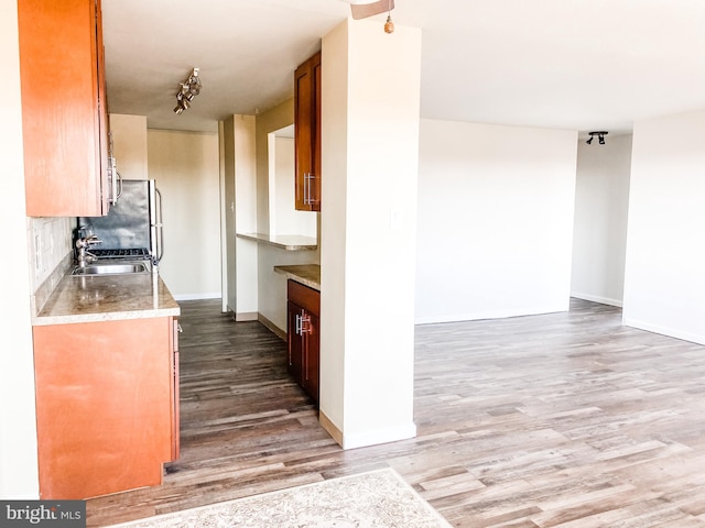 kitchen with decorative backsplash and hardwood / wood-style floors