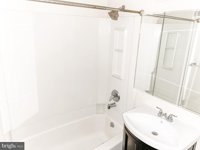 bathroom featuring vanity and bathing tub / shower combination