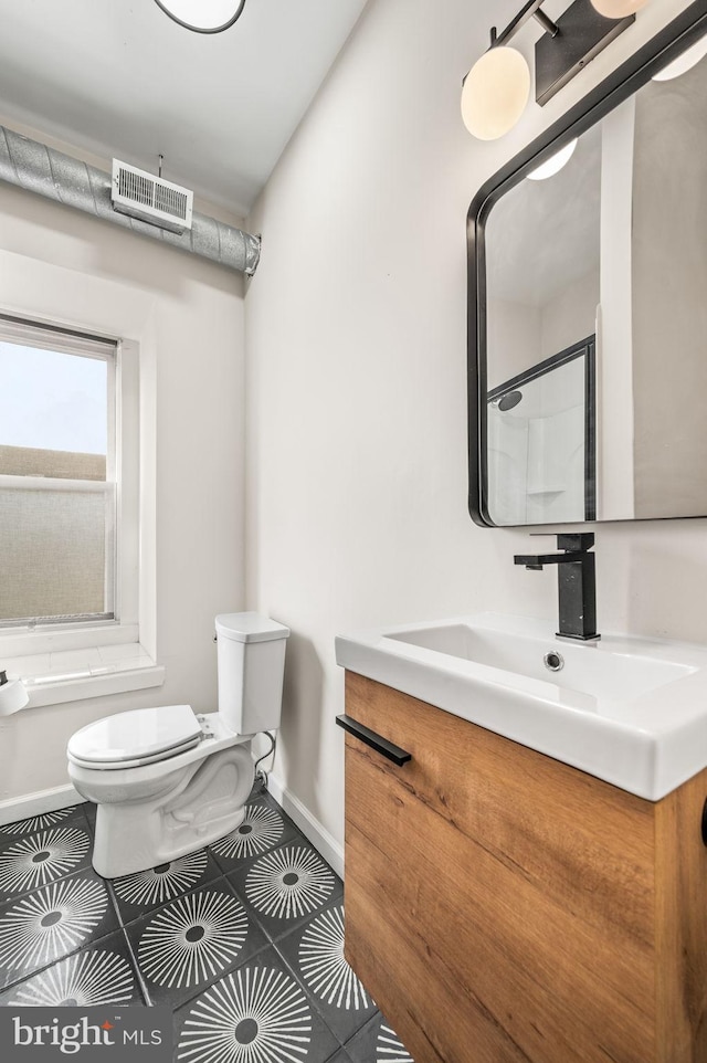 full bathroom with tile patterned floors, shower / bath combination, vanity, and toilet