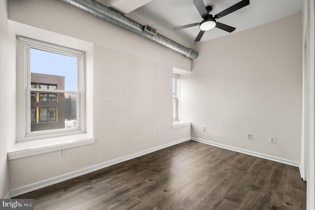 empty room featuring ceiling fan and dark hardwood / wood-style floors