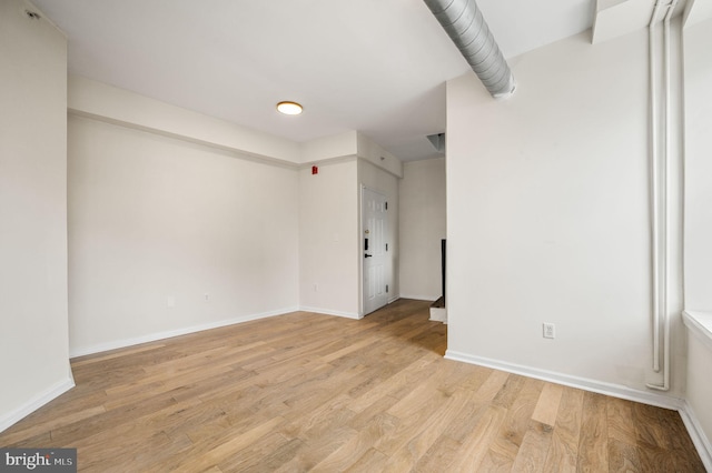 spare room featuring light hardwood / wood-style flooring