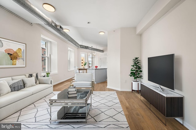 living room with light hardwood / wood-style floors