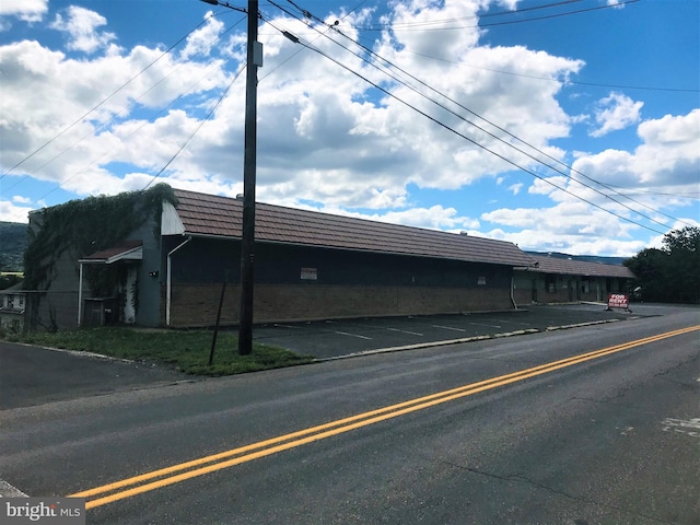 view of property featuring uncovered parking