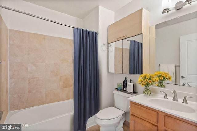 bathroom featuring shower / bathtub combination with curtain, toilet, and vanity