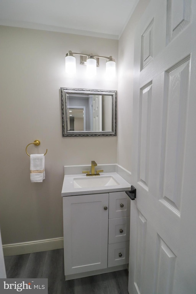 bathroom with vanity and hardwood / wood-style floors