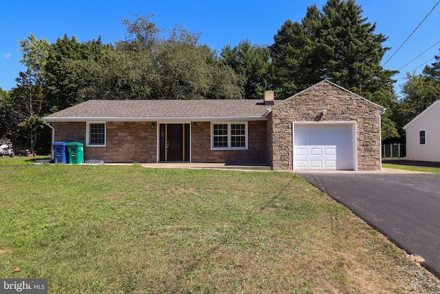 single story home featuring a garage and a front lawn