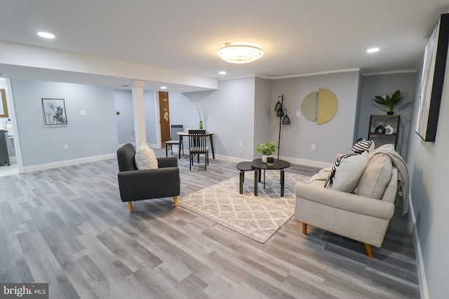 living room with hardwood / wood-style floors and ornamental molding