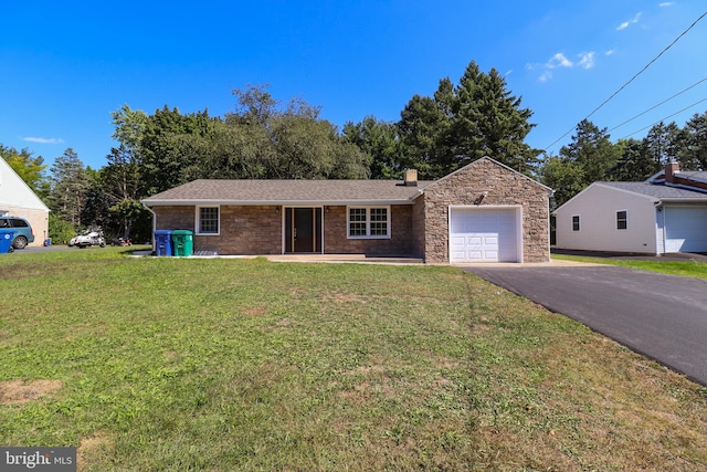 view of front facade featuring a garage and a front yard