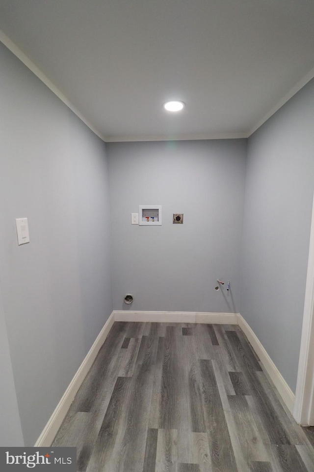 laundry room with hookup for a washing machine, crown molding, hookup for an electric dryer, and dark hardwood / wood-style flooring