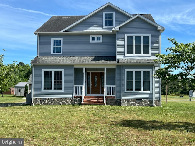 front facade with a porch and a front yard