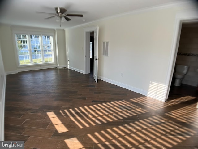 unfurnished living room with crown molding, ceiling fan, and dark hardwood / wood-style floors