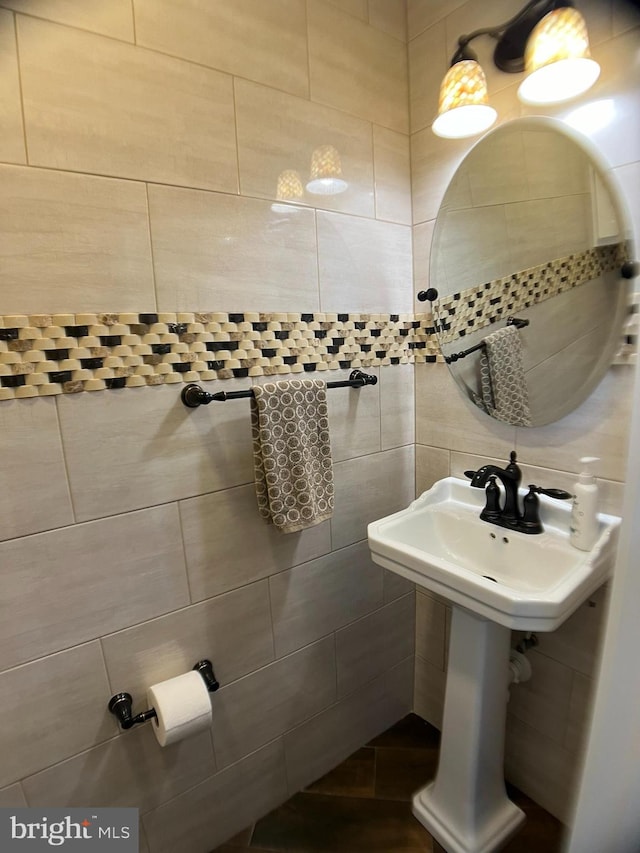 bathroom with tile walls