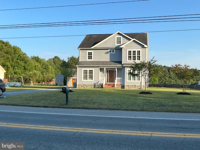 view of front facade with a porch and a front lawn