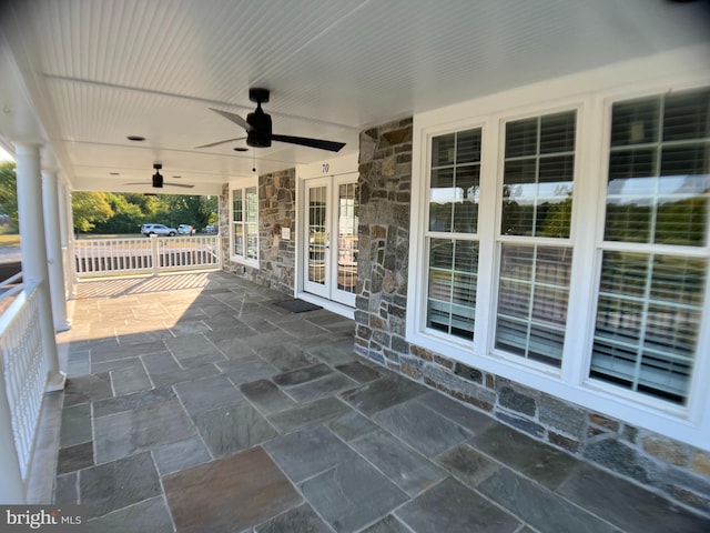 view of patio / terrace featuring ceiling fan and french doors