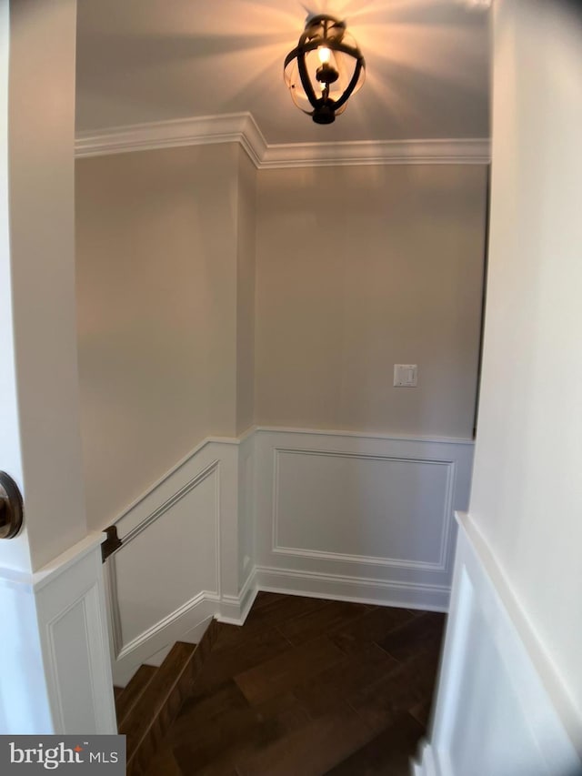 staircase featuring crown molding