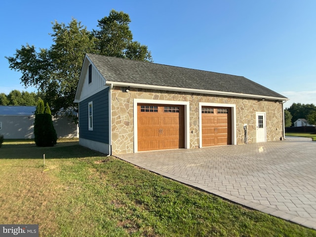 garage with a yard