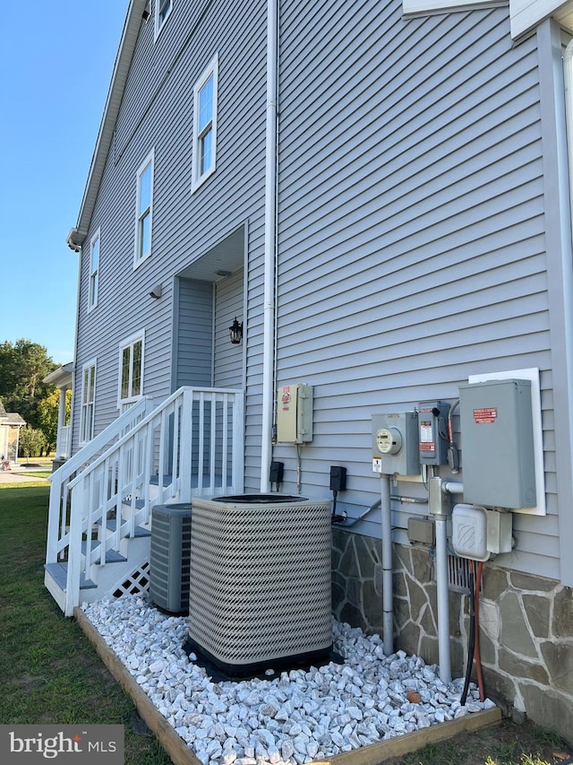 back of property with central AC unit