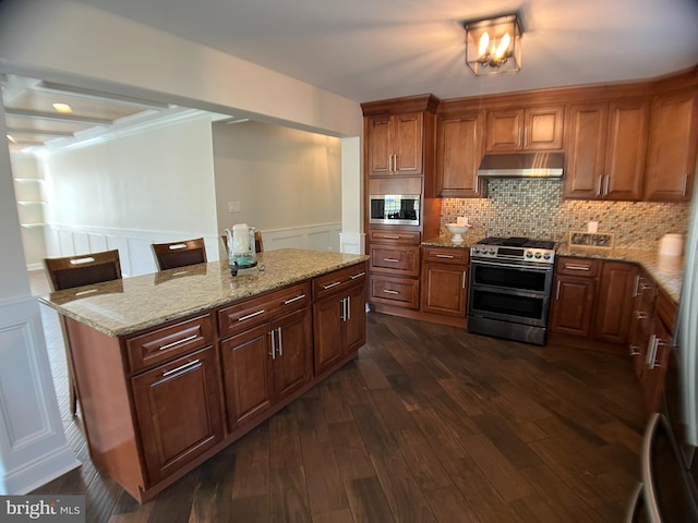 kitchen featuring decorative backsplash, light stone counters, stainless steel appliances, and dark hardwood / wood-style floors