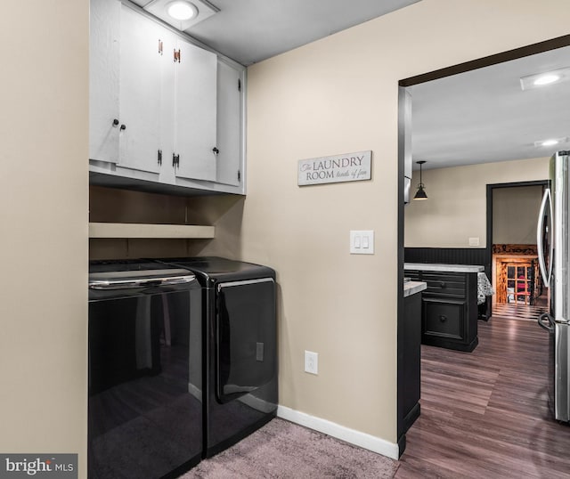 clothes washing area featuring baseboards, recessed lighting, cabinet space, dark wood-type flooring, and washer and dryer