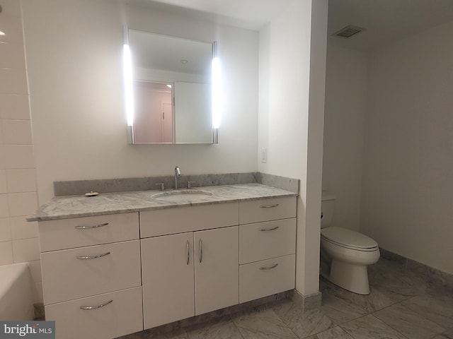 bathroom featuring marble finish floor, visible vents, vanity, and toilet