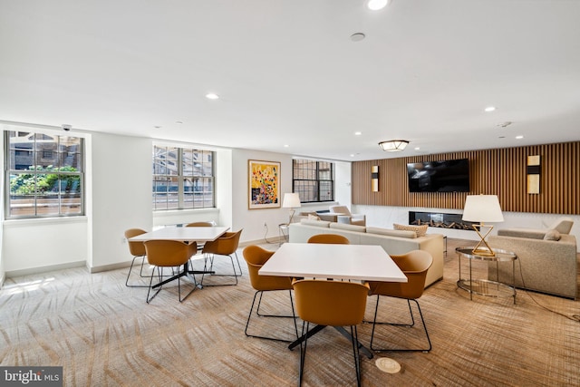 dining area with baseboards, light carpet, and recessed lighting