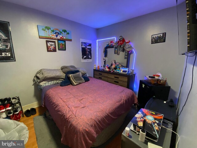 bedroom featuring hardwood / wood-style floors