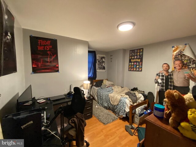 bedroom with hardwood / wood-style floors