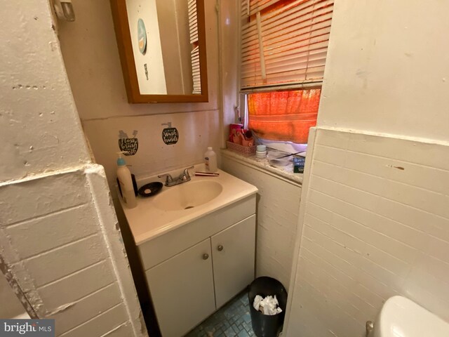 bathroom with vanity and toilet