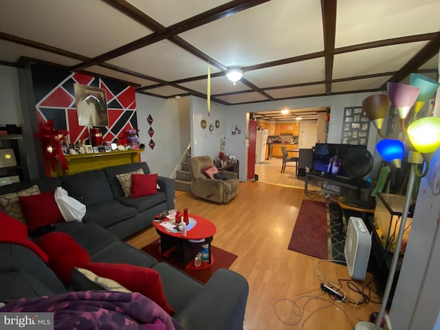 living room featuring coffered ceiling and hardwood / wood-style flooring