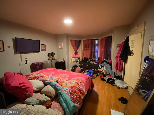 bedroom featuring wood-type flooring