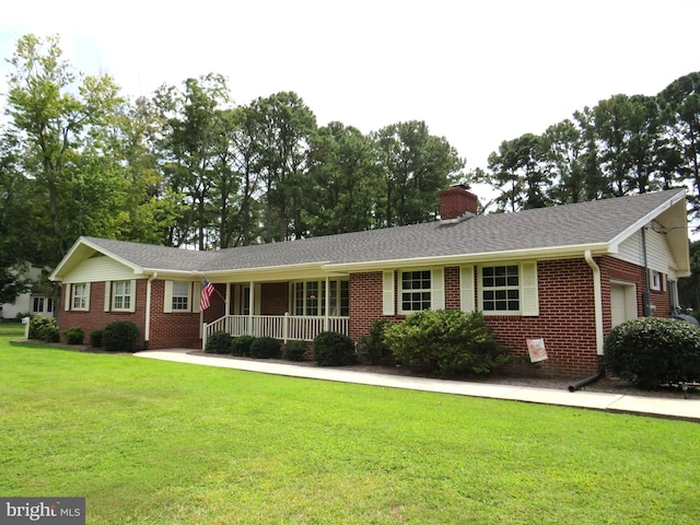 single story home with an attached garage, covered porch, brick siding, a front lawn, and a chimney