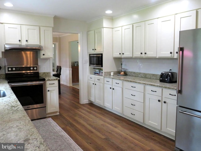 kitchen featuring dark wood-type flooring, appliances with stainless steel finishes, and white cabinetry