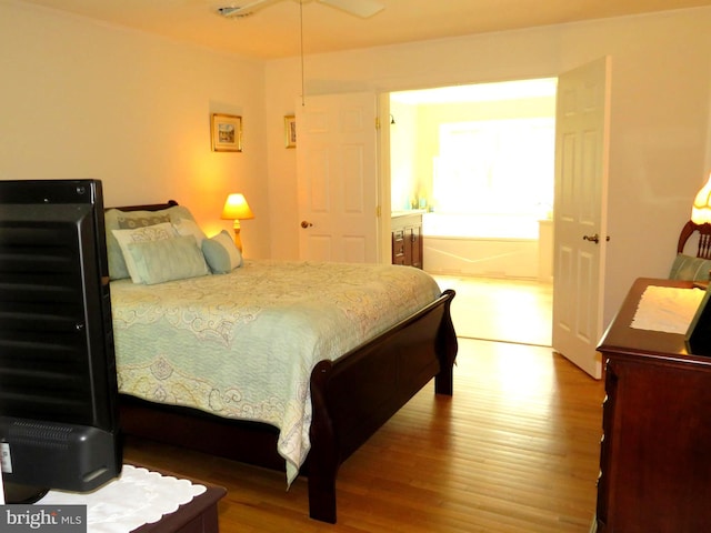 bedroom with hardwood / wood-style flooring and ceiling fan