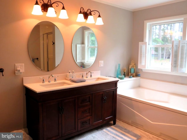 bathroom with crown molding, vanity, and separate shower and tub