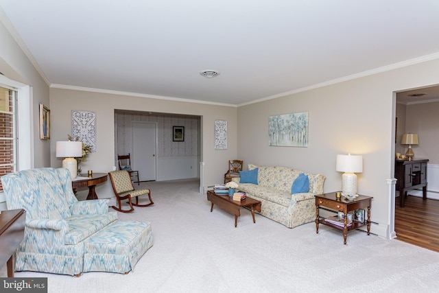 living room with crown molding and hardwood / wood-style floors