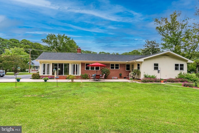 ranch-style home with a front yard