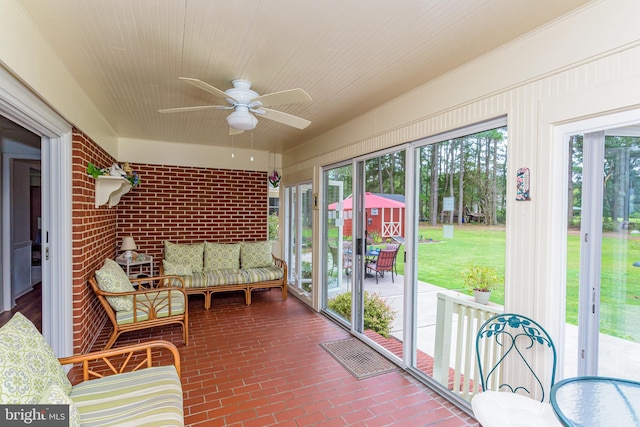 sunroom featuring plenty of natural light and ceiling fan