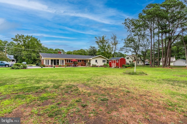 view of yard with a storage shed