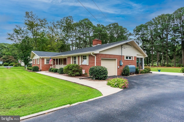 single story home featuring a front lawn, a garage, and a porch